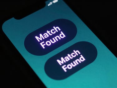 Close-up of a smartphone screen displaying a neon purple 'Match Found' notification with two overlapping circular item cards, high-contrast tech aesthetic, moody ambient lighting