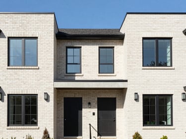 Crisp architectural photography of a modern brick residential home in Royal Oak, bright natural daylight, clean neutral tones, sharp focus, 35mm lens.
