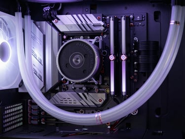 Macro shot of a custom liquid-cooled PC build, frosted tubing, clear coolant, clean cable combs, dimly lit with violet LEDs