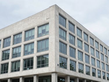 Wide architectural angle of a modern federal office building facade, clean concrete and glass, bright daylight, high detail, 35mm