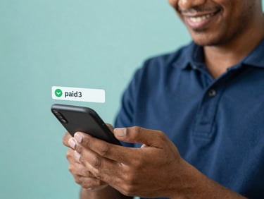 Close-up of a Brazilian worker smiling while checking a mobile banking app, with a subtle overlay showing a 'paid' notification, soft natural daylight, deep blue and teal tones