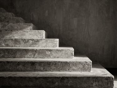Monochrome architectural detail of concrete stairs casting shadow lines, dramatic side-lighting, deep shadows, textured brush background.