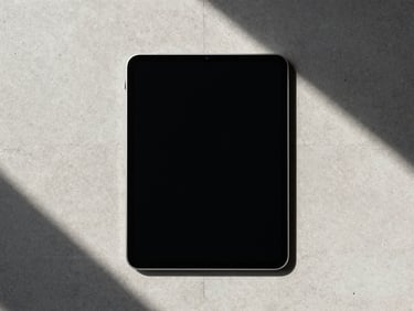 Clean digital interface framed on a physical high-end tablet, minimal concrete background, direct sunlight