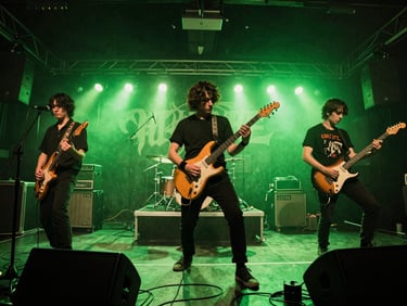 Wide-angle gritty concert photography of an indie punk band performing on a low stage, harsh neon green backlighting, deep shadows, visible grain, raw editorial style.
