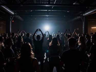 Moody wide-angle shot of a crowd dancing in a dark warehouse club, silhouette figures against a single flashing strobe light, raw high-contrast texture.