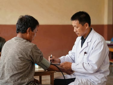 Local doctor checking a patient's blood pressure in a community hall, warm vibrant earth tones, candid documentary photography, 35mm lens