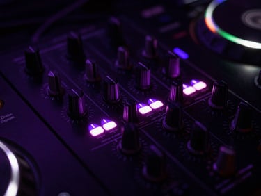 Macro shot of professional DJ mixer knobs and glowing level meters showing electric violet peaks.