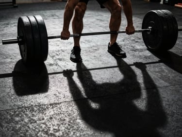 Dynamic low-angle action shot of an athlete heavy lifting, strong directional shadows