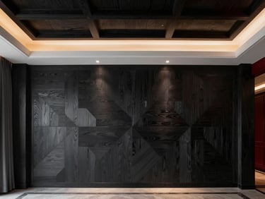 Luxury room featuring a custom coffered ceiling and geometric dark charcoal wood feature wall, warm architectural lighting