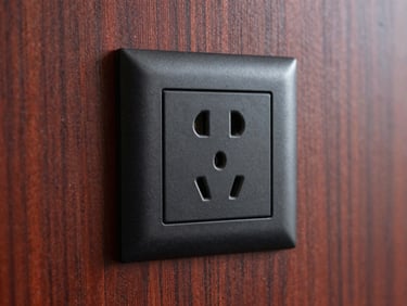 Macro shot of a black electrical outlet perfectly integrated into a custom wood panel wall, seamless craftsmanship.