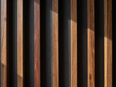 Close-up of vertical oak wood slats on a dark charcoal backing, sharp architectural lines, raking light.