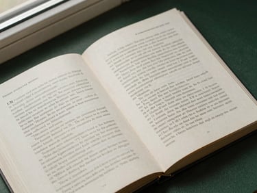 An overhead flat-lay of a published book open to a chapter page, showcasing clean layout design and warm-toned paper.