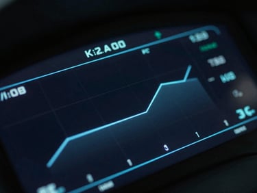 Extreme close-up of a dark, high-contrast digital dashboard interface showing glowing blue data points and clean geometric charts, cinematic lighting.