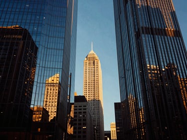 Symmetrical portrait of Chicago skyscrapers reflecting in glass facade at golden hour, high contrast