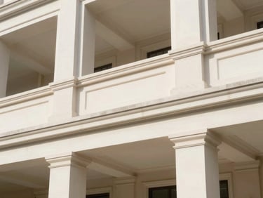 Architectural detail of a classic building facade, clean lines, bright natural daylight, soft shadows, high-end, 35mm lens