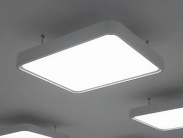 Structured architectural lighting fixtures on a clean ceiling, high-contrast crisp daylight, sharp technical focus.