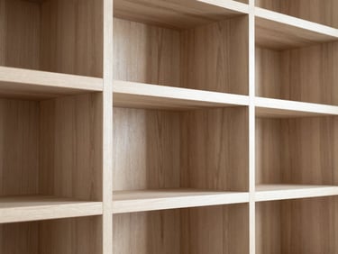 Detail of custom oak built-in bookshelf, tight joinery, crisp architectural focus, natural light