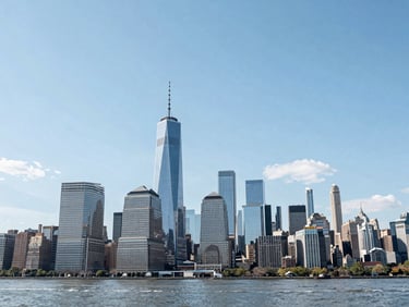 Wide-angle architectural view of the Manhattan skyline from Staten Island, bright daylight, crisp focus, blue and white tones