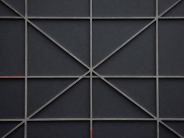 Abstract geometric pattern of interconnected lines and nodes on a dark background, evoking a complex system diagram, desaturated slate and charcoal tones with a hint of muted crimson.
