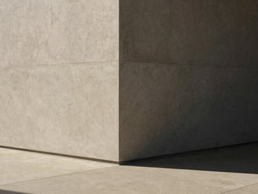 Minimalist architectural corner of a modern Australian office, soft natural daylight casting shadows on warm concrete, 35mm photography