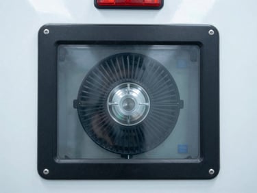 Close-up of a transport ventilator screen displaying active readings inside an ambulance, clean background, bright clinical lighting.