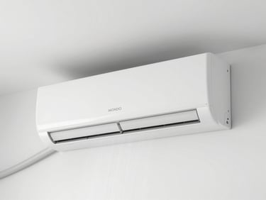 A clean, modern split AC unit mounted on a sterile white wall, with a subtle stream of crisp, cool air visually indicated by clean lighting, high-key natural daylight.