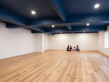 Modern basement interior with high-end finishes, a family relaxing, showing the value of a completed renovation, bright and warm lighting.