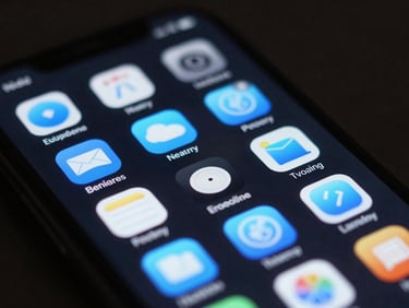 Macro close-up of a mobile screen displaying a clean, dark-mode home screen with electric blue icons, fluid animation blur visible, low-key studio lighting.