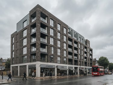 Exterior architectural shot of a modern brick building on Uxbridge Road London, overcast daylight, desaturated tones, 35mm lens