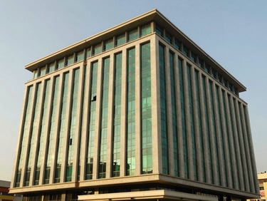 Modern commercial building facade in Mass Media, Lusaka, clean architectural lines, bright daylight