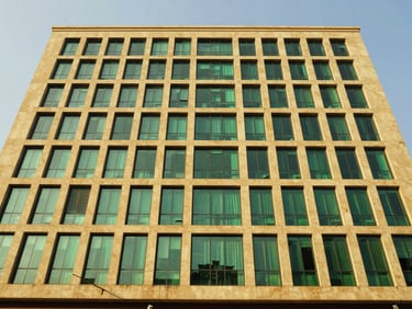 Modern commercial building facade in Roma Lusaka, sharp wide-angle lens, bright natural daylight