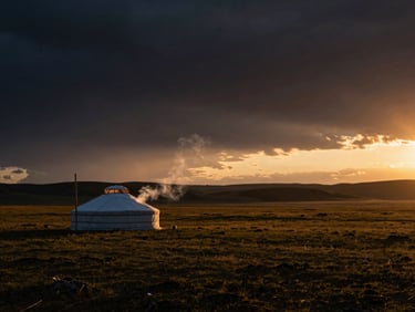 Vast dramatic landscape of the Mongolian steppe at sunset, a single luxury yurt with smoke gently rising, dramatic high-contrast lighting.
