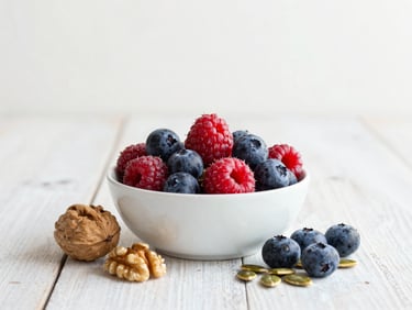 A bowl of fresh berries, walnuts, and pumpkin seeds on a rustic table, soft morning light