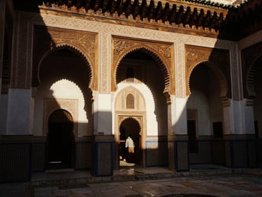 Warm editorial photography of a restored riad courtyard in Fes, natural light highlighting carved cedar wood and plaster details, rich deep shadows, cinematic composition.