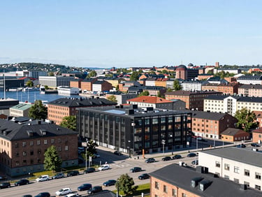 Cityscape of Gothenburg, Sweden, with the harbor and Lilla Bommen building, under bright daylight, wide shot.