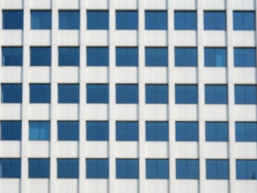 Minimalist architectural detail of a modern corporate headquarters in Mumbai, bright natural daylight, soft shadows
