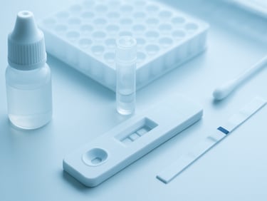 Macro clinical shot of diagnostic kits and laboratory testing products under clean white light