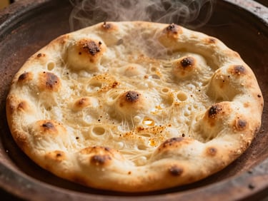 Overhead macro shot of fresh garlic naan being pulled from a traditional clay tandoor oven, golden brown blisters, steam rising, warm ambient lighting, 35mm