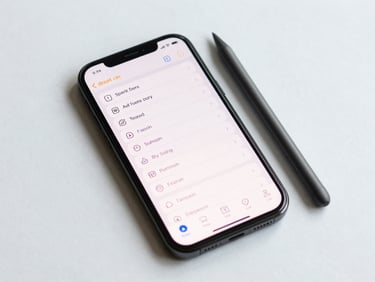 Overhead studio shot of an Android phone displaying a compact task list app, stylus resting beside the phone, even white studio lighting, minimal background