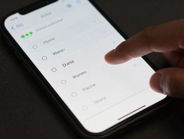 Close-up of an Android phone screen showing a clean quiz interface, finger mid-tap on an answer option, natural daylight from the left, dark surface beneath the device