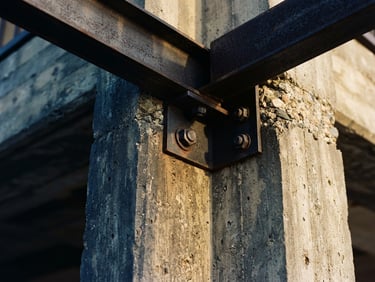 Tactile macro detail of structured concrete and steel architectural lines, warm coastal Florida sun, soft shadows, 35mm