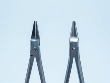 Macro shot of surgical forceps tips aligned perfectly under bright clinical studio lighting, cool blue tones
