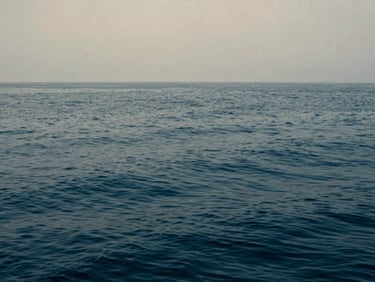 Abstract close-up of deep blue ocean water texture, calm surface, soft overcast lighting, medium format film