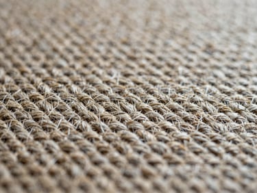 Macro texture detail of flat-weave warp and weft threads, raw unrefined texture, muted neutral tones.
