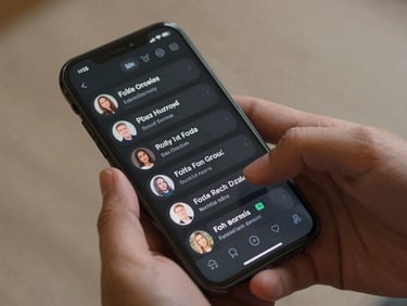 Close-up of a mobile phone screen displaying AI-generated social media captions in a dark-themed interface, hands holding the phone, sharp studio lighting