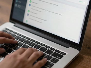 Close-up of a laptop trackpad and keyboard with a WhatsApp automation dashboard visible on screen, message scheduling interface open, crisp overhead daylight, tight crop on the screen and hands