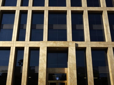 Modern architectural bank facade of Central Bank of Iraq, sharp daylight, premium corporate photography, 35mm