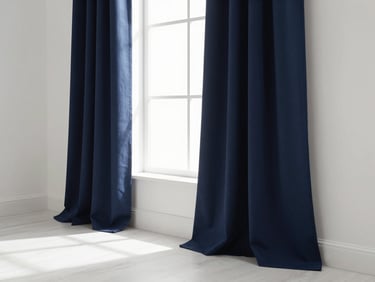 Elegant navy blue blackout curtain draped in a modern sunlit living room, architectural window, soft natural window light, crisp whites and deep navy tones, shallow depth of field, 35mm