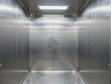 Symmetrical interior view of a clean, empty stainless steel medical cargo container, sterile white clinical lighting, reflecting precise structural ribbing and temperature probes.