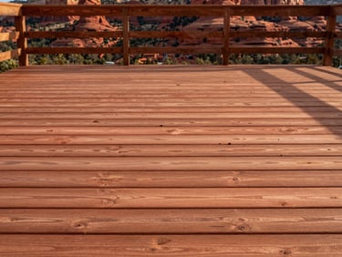 Straight-on architectural view of a newly rebuilt Sedona wood deck, warm terracotta tones, sharp focus on precise joinery.